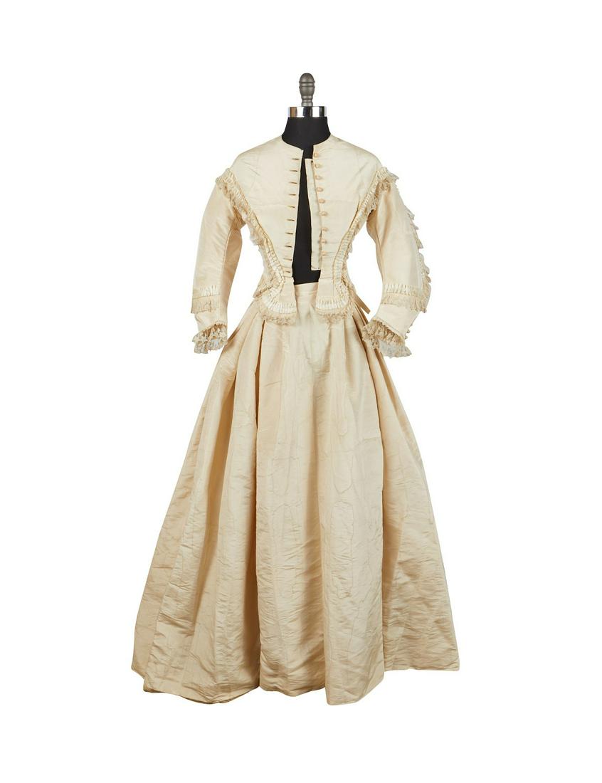Victorian Era White Silk Moire Dress: Victorian era white silk moire dress, two pieces with a skirt and jacket. With lovely lace and ruched trim along the jacket. Button enclosures. (Approximate) Jacket; Shoulder-to-shoulder: 16 in x slee