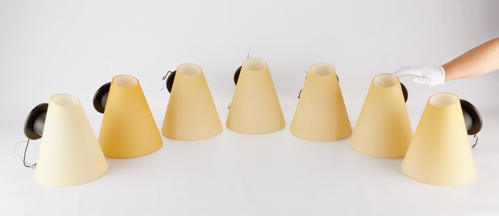 7 Leucos Italian Glass Wall Sconces: Leucos, Italy. Group of seven conical glass wall sconces. Founded by Eugenio Pamio in Scorze, Italy in 1962, Leucos Lighting is known for its marriage of contemporary design and old-world Venetian gla
