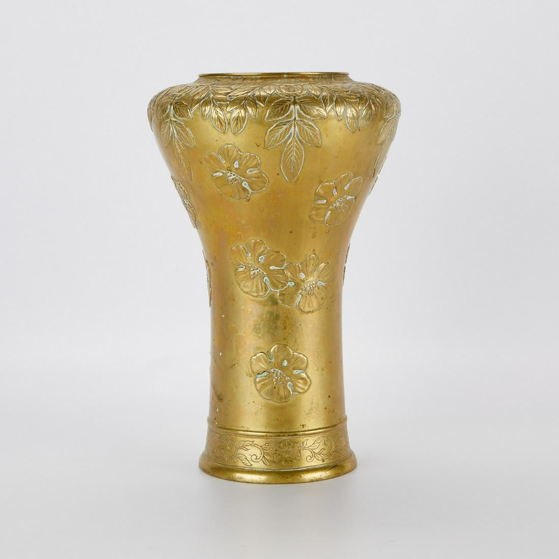 Large French Bronze Art Nouveau Vase: Large French Art Nouveau bronze vase depicting sprays of falling flowers, possibly hibiscus, and hanging foliage. Signed illegibly along the underside. With high shoulders and a tapered body. Height: 