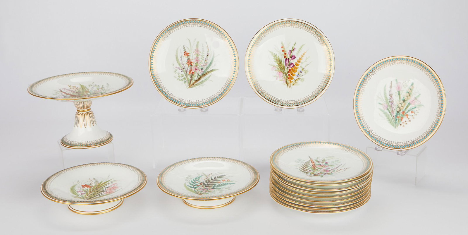 Grp 15 Royal Worcester Hand Painted China 1875: Royal Worcester, England. Group of hand-painted fine bone china including 12 plates, two low tazzas, and one tall tazza. Each decorated with intricate and uniquely painted sprays of flowers and other 