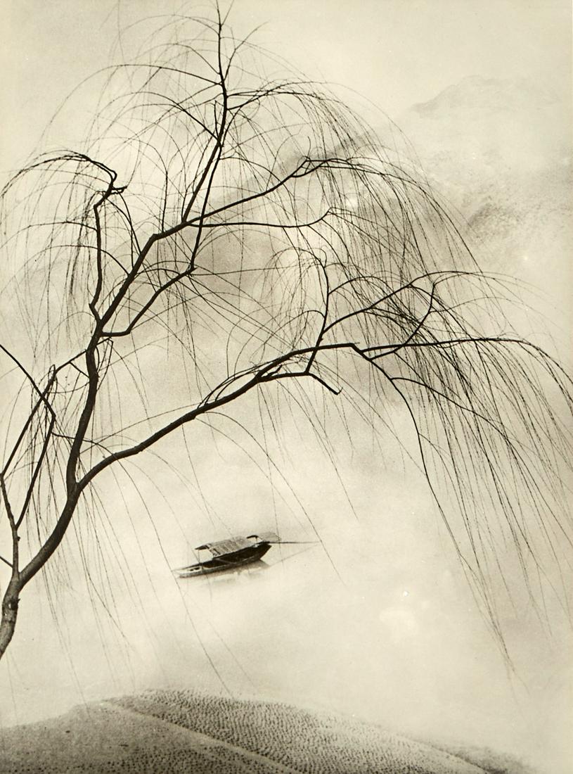 Chin San Long Photograph "Spring Fantasia": Chin San Long (Lang Jingshan) (Chinese, 1892-1995). Photograph titled "Spring Fantasia," executed in 1945, depicting a boat floating through mist behind the dramatic silhouette of branches. 