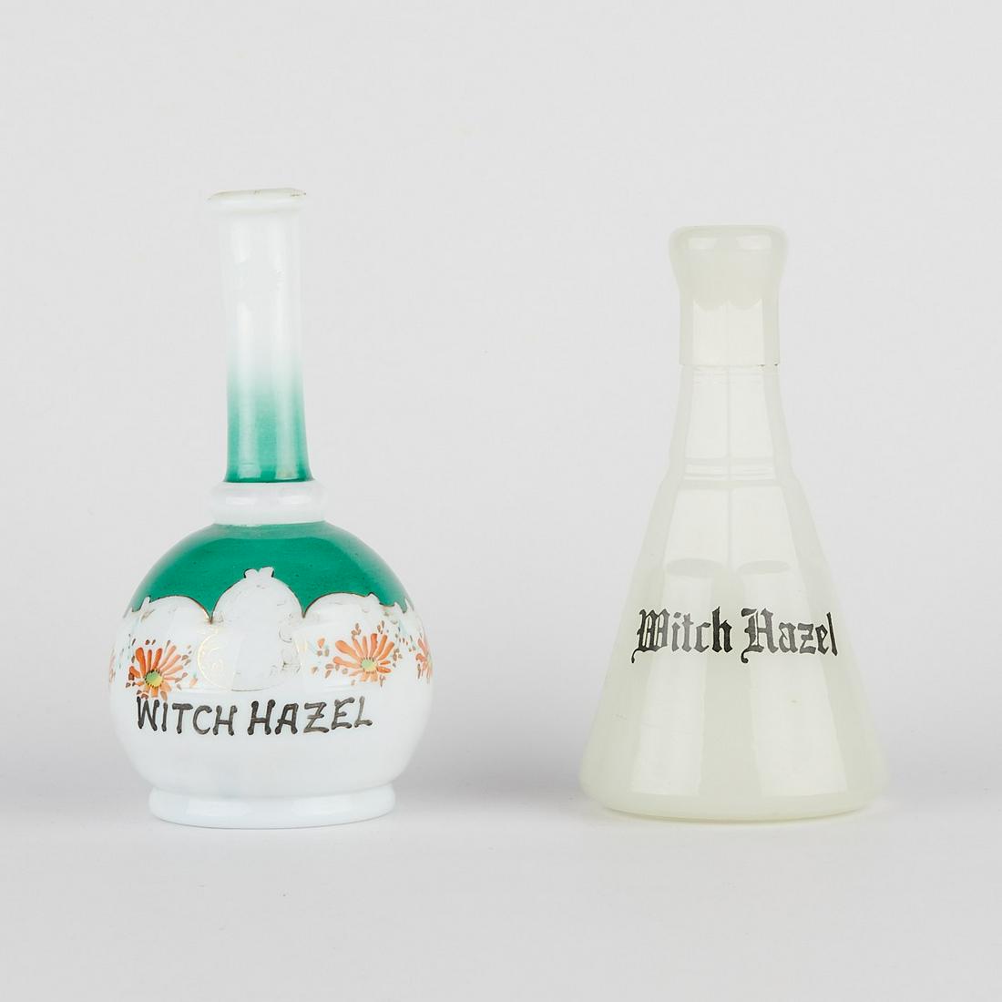 Pair of Witch Hazel Glass Barber Bottles: Pair of antique glass witch hazel barber bottles. One clambroth white bottle marked E.W. Inc along the bottom. One milk glass bottle with hand-painted decoration, possibly in the style of Koken. (Milk