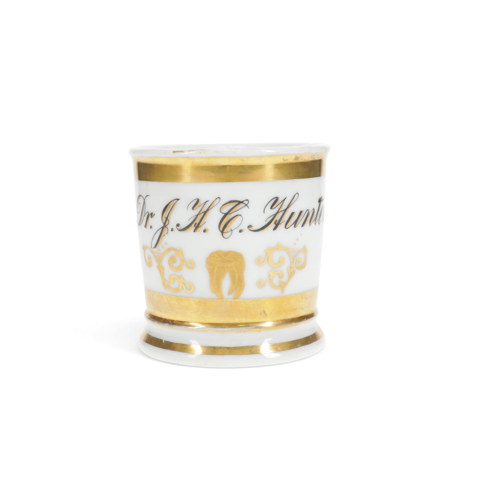 Vintage Porcelain Occupational Mug - Dentist: Vintage antique porcelain occupational shaving mug for a dentist. With a golden tooth and trim. The name Dr. J. H. C. Hunter is written along the side.Height: 3 1/2 in x diameter (without handle): 3 1