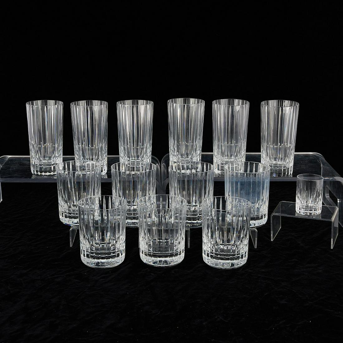 Set 14 Baccarat Harmonie Glass Tumblers: Baccarat, France. Group of 14 "Harmonie" pattern crystal glass tumblers in three sizes: seven medium, six tall, and one small shot glass. Each marked along the underside.Height ranges from 2