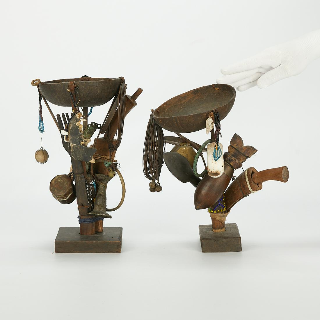 2 Ritual Ceremonial Fetishes Nagaland India: Group of two ritual ceremonial fetishes from Nagaland, north of India. Each with cups along the top with various hanging decorations including animal bones. Provenance: Allan Stone Gallery in New York