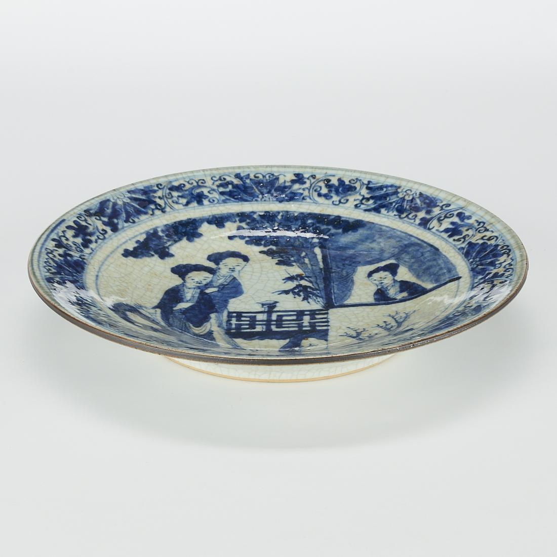 19th c. Chinese Blue & White Porcelain Platter: Chinese blue and white porcelain dish with a cafe au lait brown rim, late 19th century. Painted decoration depicting two women in a garden while a third gazes out of a window. The rim decorated with f