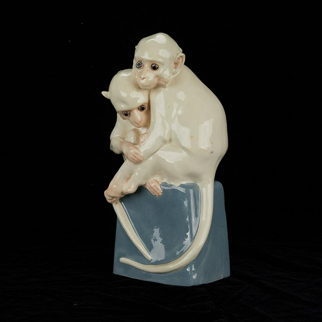 Vienna Porcelain Monkey Sculpture Lamp: Wiener Kunstkeramische Werkstatte Busch & Ludescher (Vienna Ceramic Workshop), Vienna, Austria. Porcelain perfume lamp in the form of two white embracing monkeys on a blue plinth. Marked along the int