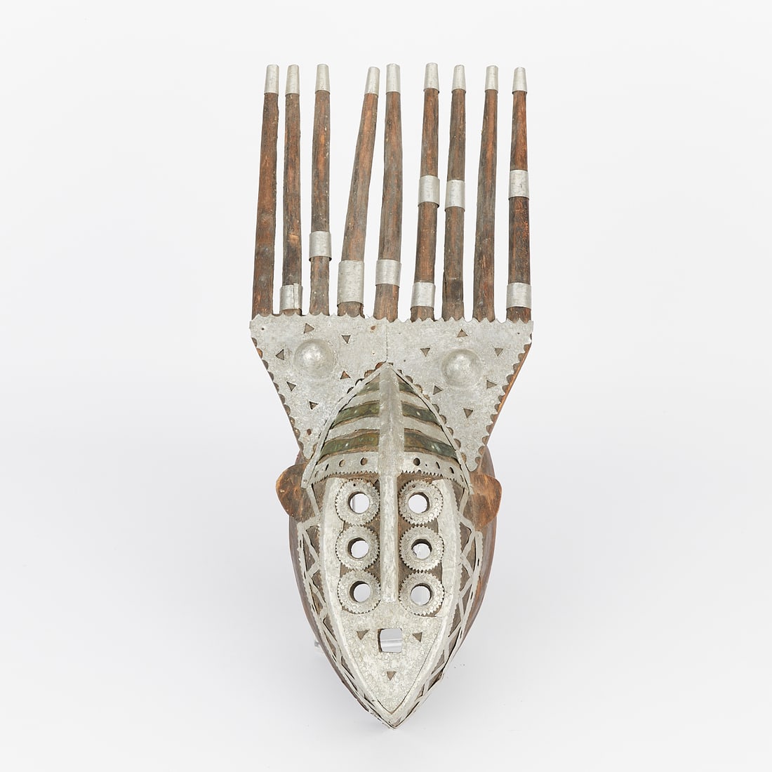 Boys' Initiation Mask N'Tomo Bambara Style: N'tomo boys' initiation mask. Carved wood with metal fittings. N'tomo masks are used by the Bambara people of West Africa. Provenance: From the distinguished collection of the Walker Art Center, Minne