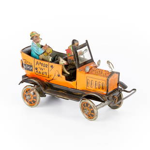 Vintage Marx "Amos 'n' Andy" Wind-up Toy: Vintage tin wind-up toy car produced by Louis Marx & company in 1930. The toy is based on the popular radio show “Amos ‘n’ Andy,” which aired from 1928 to 1960. When wound up the car rolls