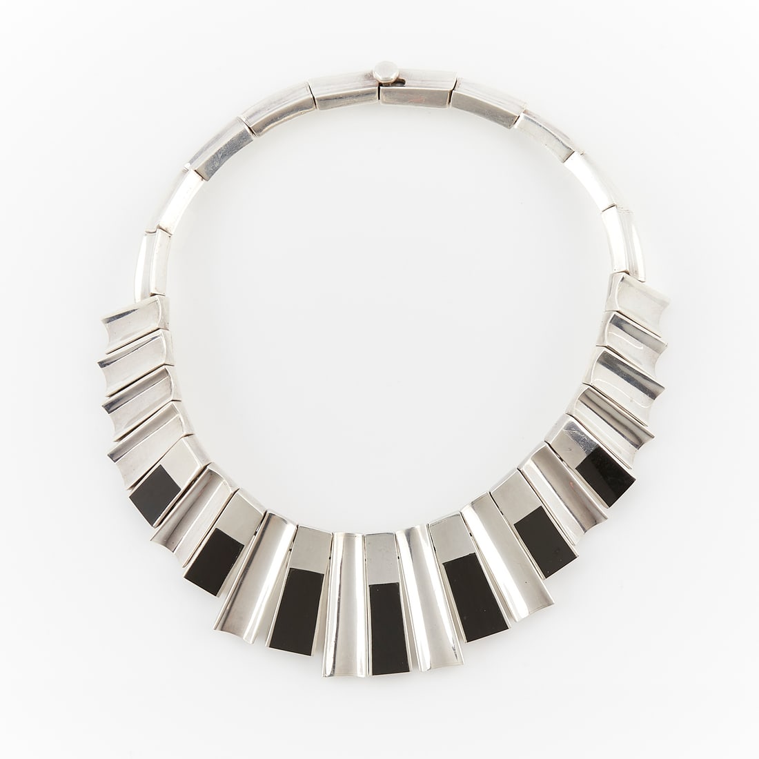 Monteros Silver & Onyx Bib Necklace: Monteros Taxco, Mexico silver and onyx bib necklace, formed of 21 vertically set graduating placards with ten horizontally set ones, seven of the vertical placards inlaid with onyx. With box clasp at 