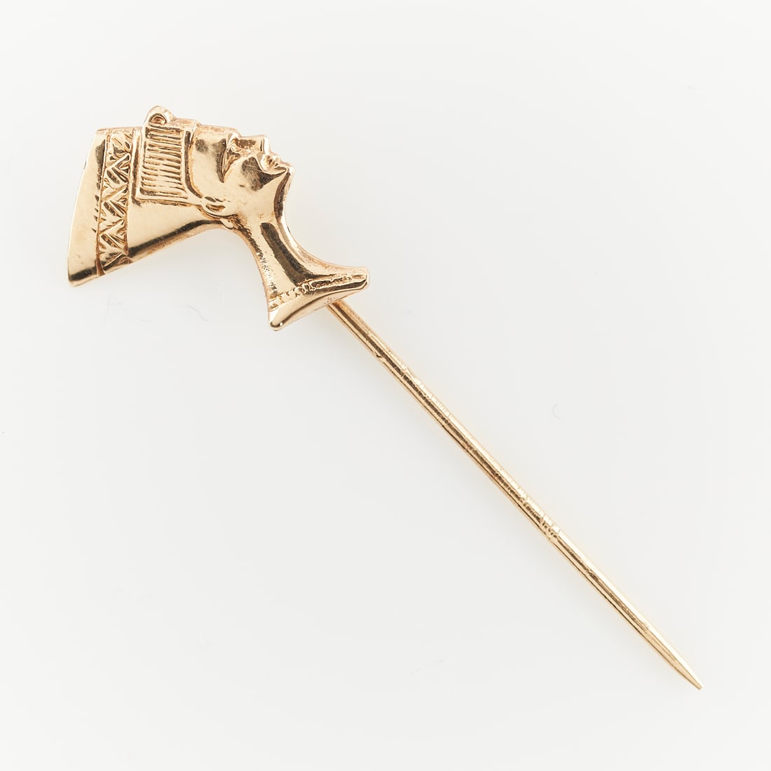 14k yellow gold stick pin with Nefertiti: 14k yellow gold stick pin with bust of Nefertiti, marked "14k KP YUGOSLAVIA" along the stick. Length: 1.5 inches. Gross weight: 1.4 grams