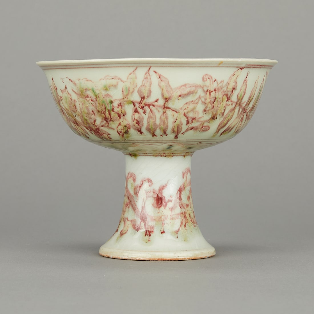 Chinese Late Qing High-Footed Porcelain Bowl: Chinese late Qing Dynasty porcelain bowl with a high foot. Decorated in green and red with scrolling floral and foliate motifs. Height: 4 1/2 in x diameter: 5 1/4 in.