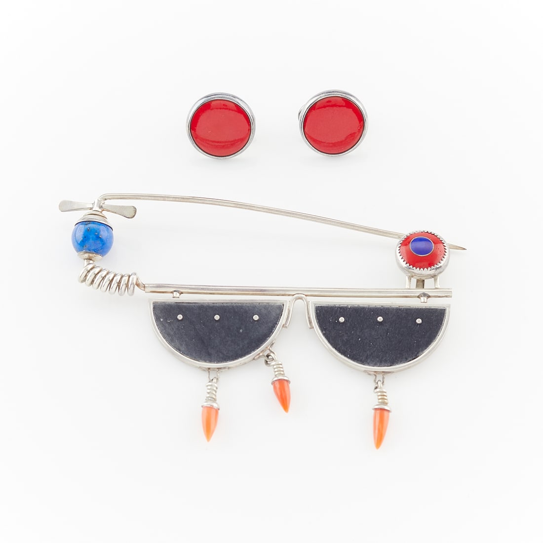 Heinz Brummel Earrings and Brooch: Heinz Brummel modernist carnelian disc earrings bezel set in silver with posts and omega backs, each signed "Heinz." Fibula closure silver brooch with two black enamel half circles, suspending three c