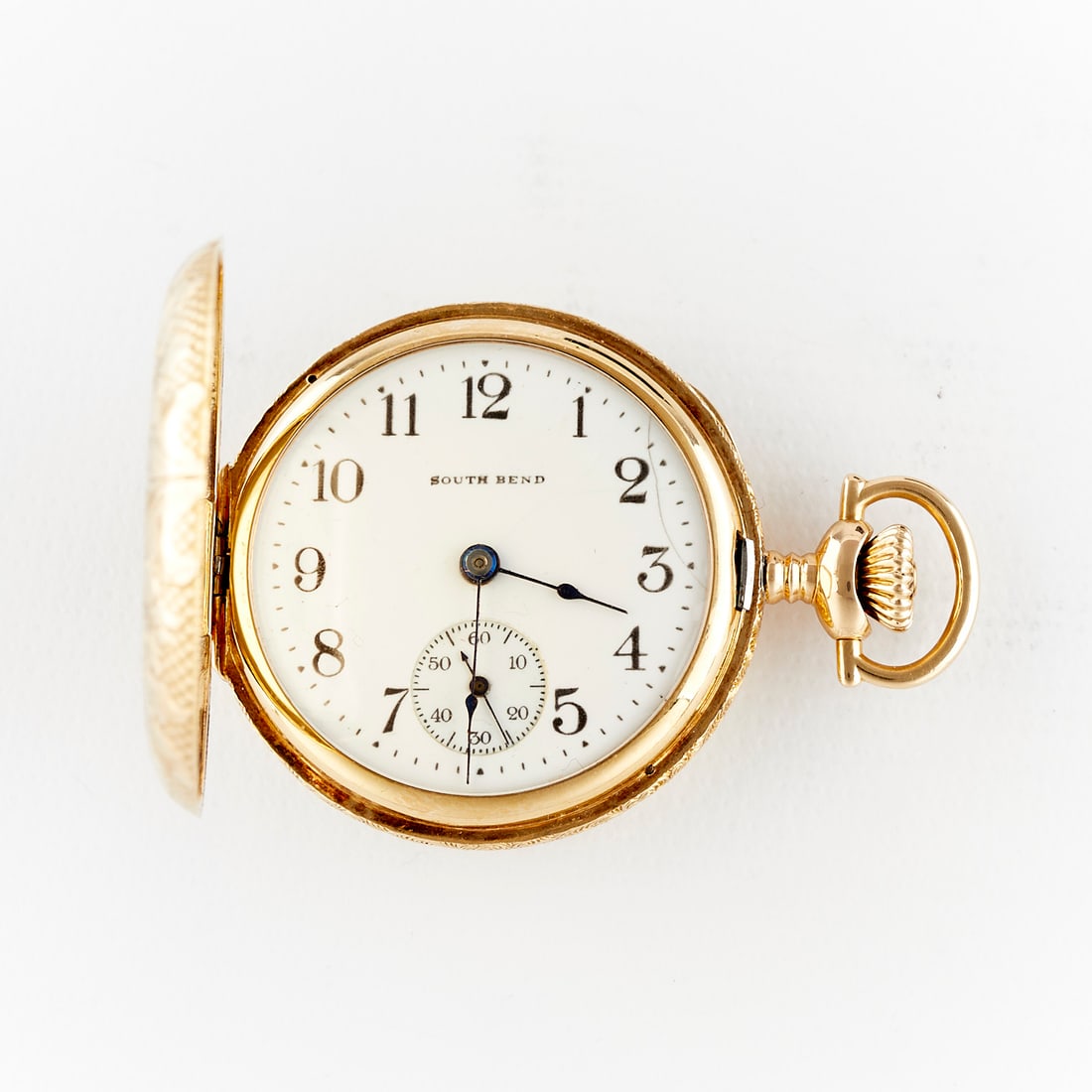 Southbend 14k Gold Filled Pocket Watch: Southbend Watch Co., United States. One pocket watch in a 14k yellow gold filled hunter case with ornate floral engraving and initials "JJ." White dial marked "Southbend" with Arabic numeral hour mark
