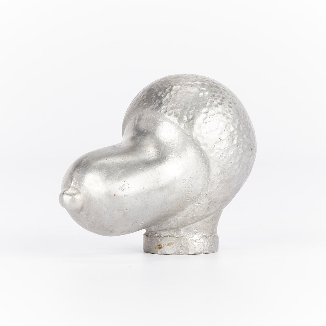 Flying Ace Snoopy Paperweight: One silver-colored metal or pewter paperweight in the form of Snoopy's head, dressed as the Flying Ace.Height: 3 in x width: 2 1/4 in x depth: 3 3/4 in.