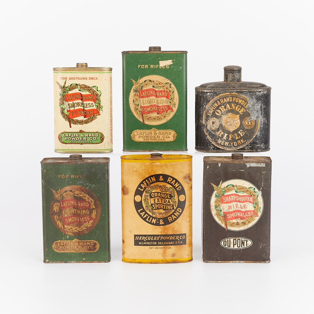 6 Antique Gunpowder Tins - Laflin & DuPont: Group of six antique lithographed gunpowder tins. Five Laflin and Rand including: two tins of lightning smokeless powder for rifles; one tin of orange extra sporting manufactured by Hercules Powder Co