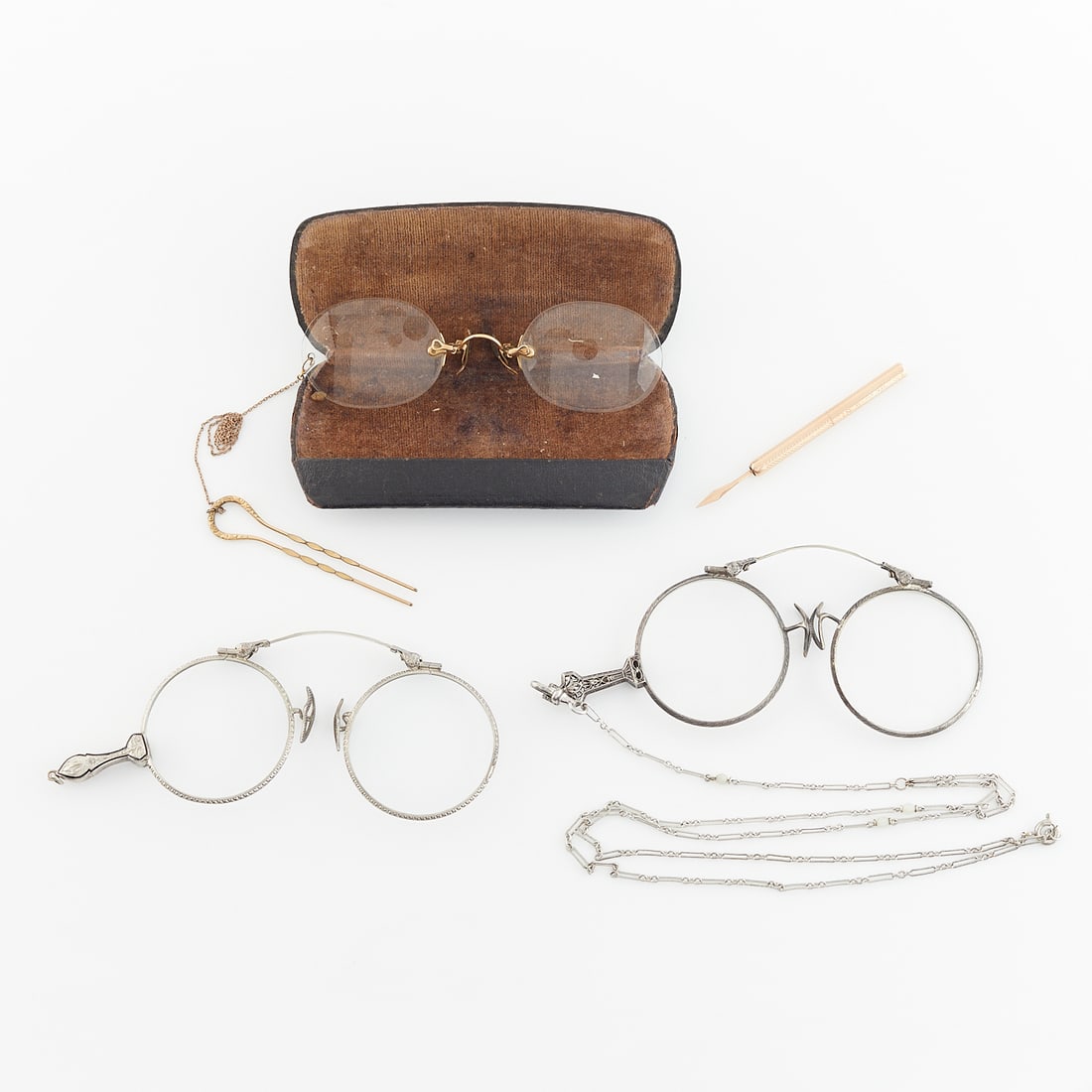 Group Lot 14k Gold Lorgnettes & 14k Tooth Pick: Group of three lorgnettes and a gold tooth pick.14k yellow gold tooth pick in engraved gold case marked Fairchild 14 KT, the case twists to deploy a tooth pick with diamond shaped point, marked 14k on