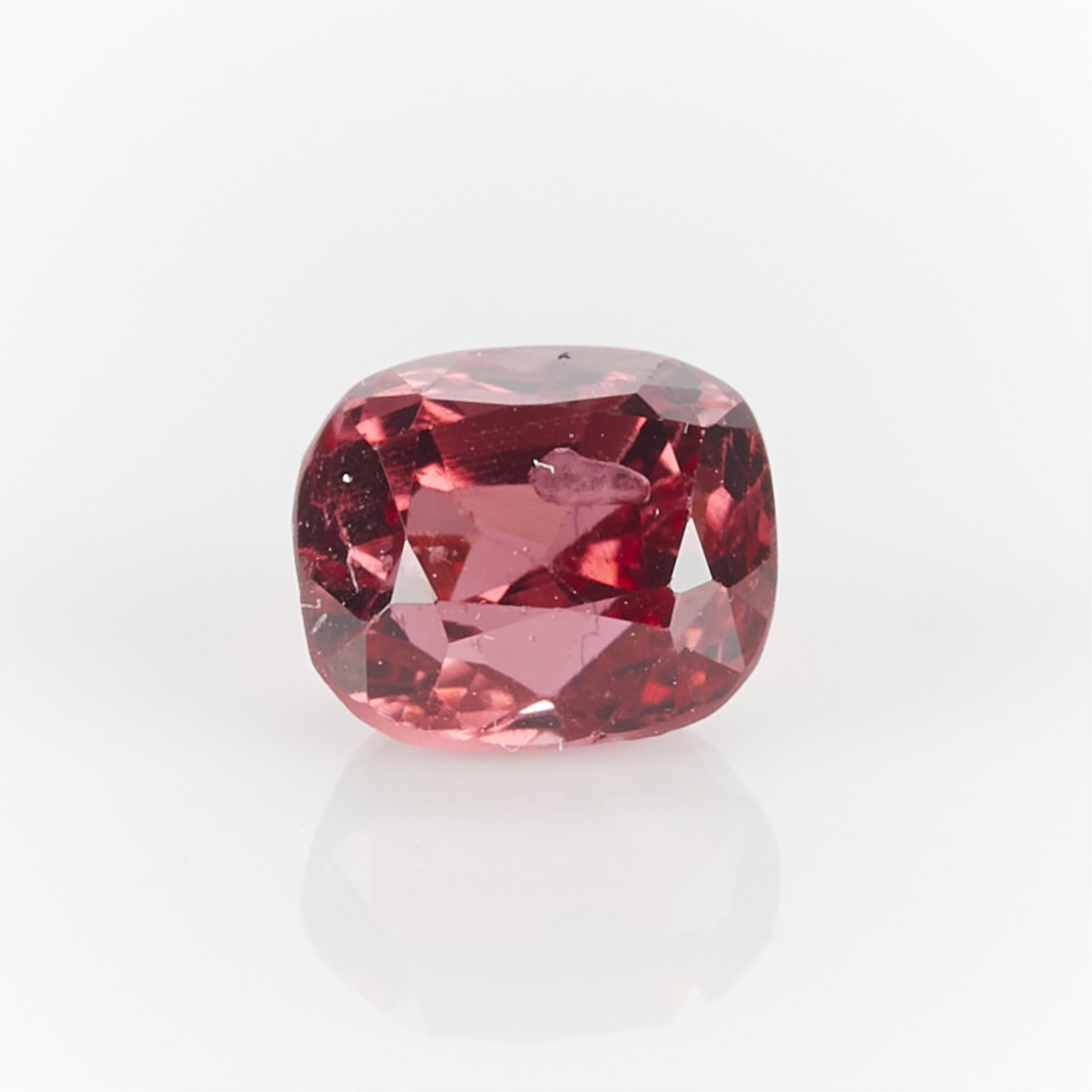 1.25 Ct Cushion Pink Spinel: One 1.25 carat cushion cut pink spinel. Length: 5.91 mm x width: 5.21 mm x depth: 4.83 mm. Gross weight: 1.25 ct.