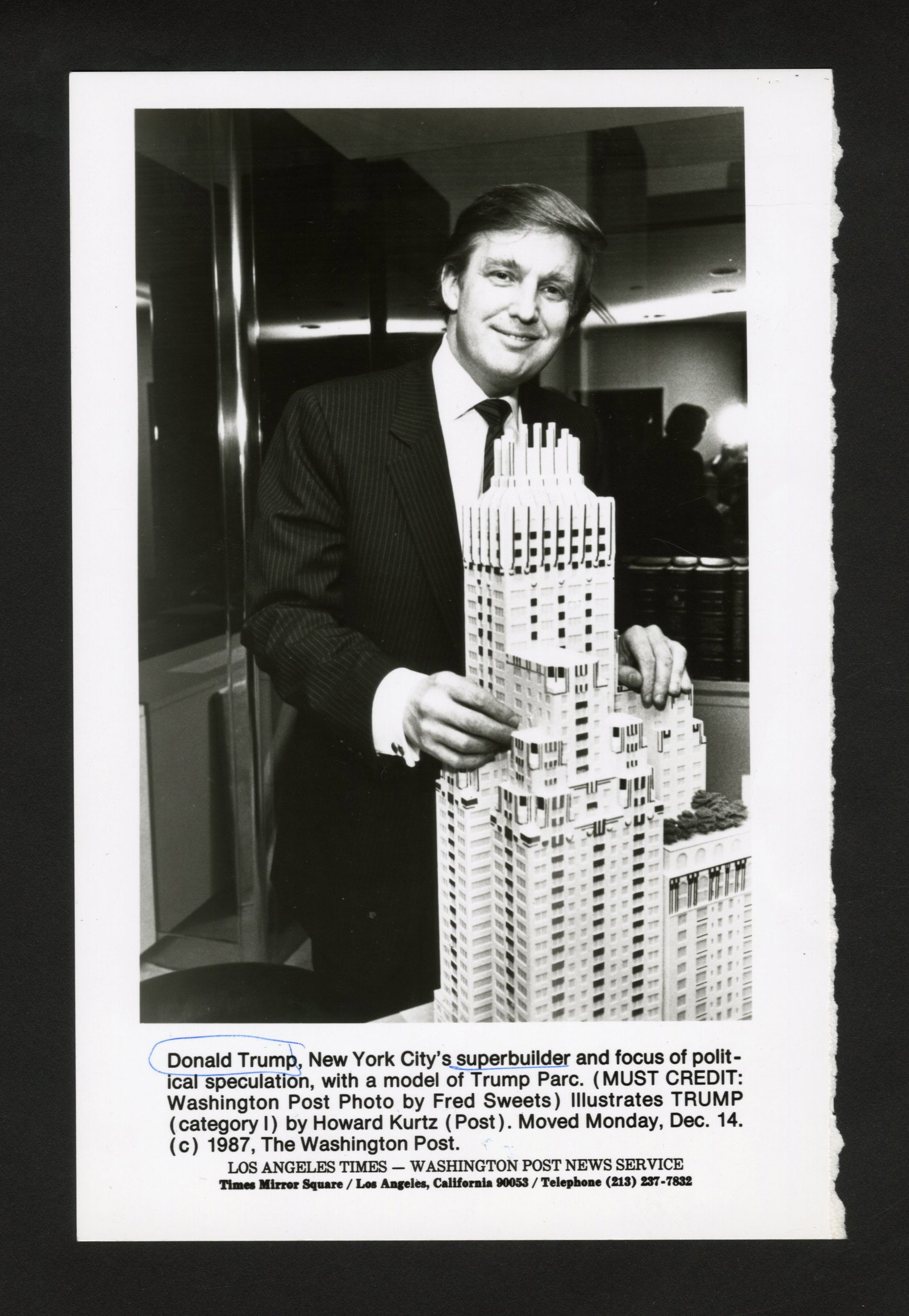 Donald Trump Photo from Star Tribune Archives: One gelatin silver print or original vintage photographic reproduction from the archives of the Star Tribune depicting a press shot of businessman and former president Donald Trump with a model of Tru