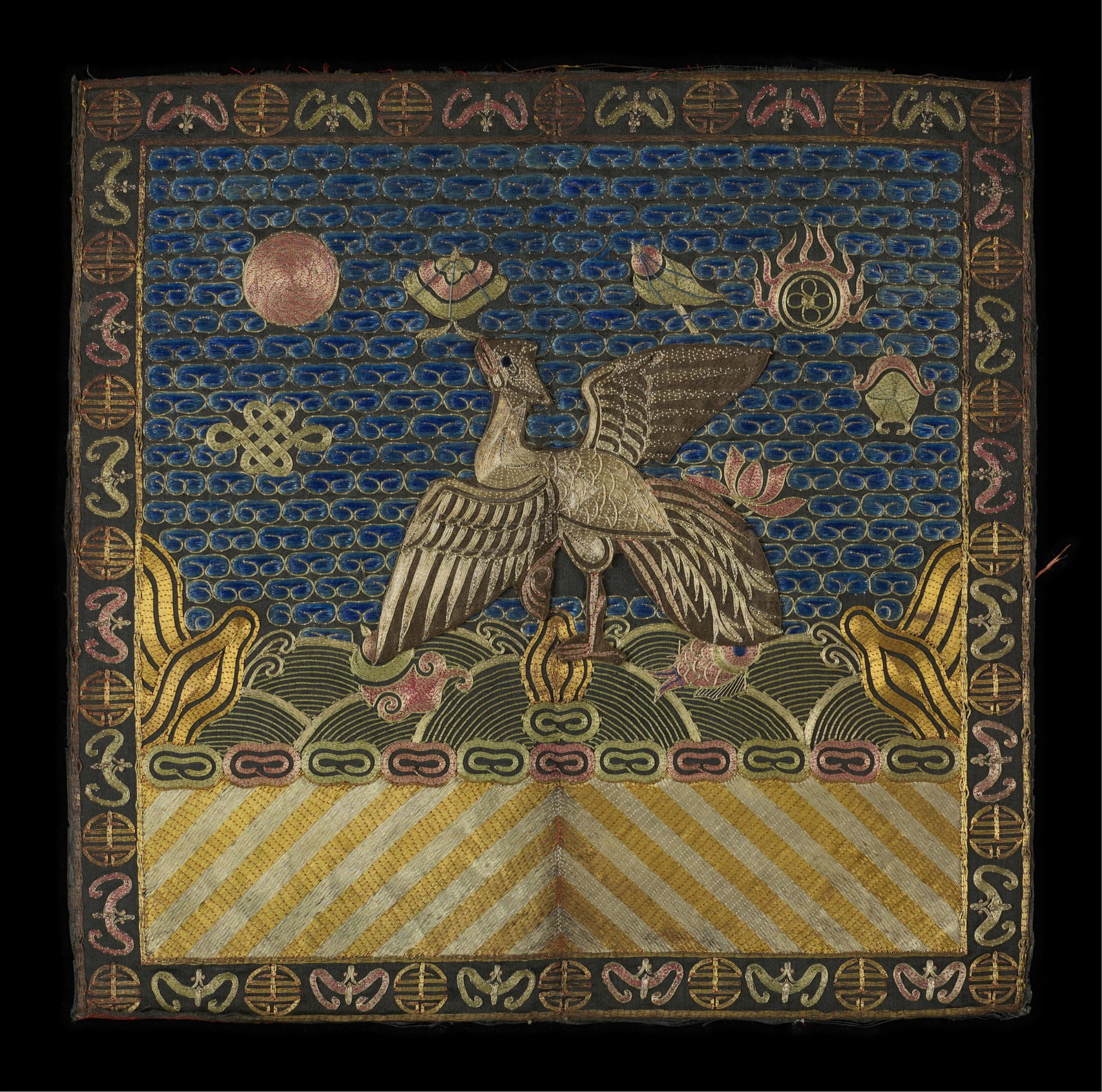 Chinese Qing Silver Pheasant 5th Rank Badge: Chinese late Qing silk civil official's rank badge, fifth rank, depicting a silver pheasant. The bird is surrounded by apocryphal symbols and a red sun above striped white and gold. The edges with alt