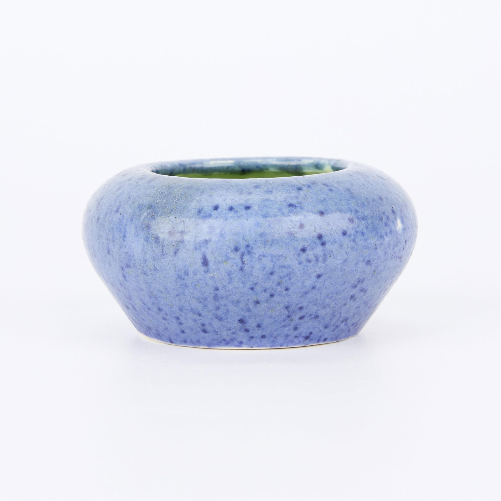 Grueby Arts & Crafts Small Pottery Bowl: The Grueby Faience Company, United States. American Arts & Crafts ceramic pottery cabinet bowl. Mottled blue glaze along the exterior and green glaze along the interior. Height: 1 1/2 in x diamer: 3 1