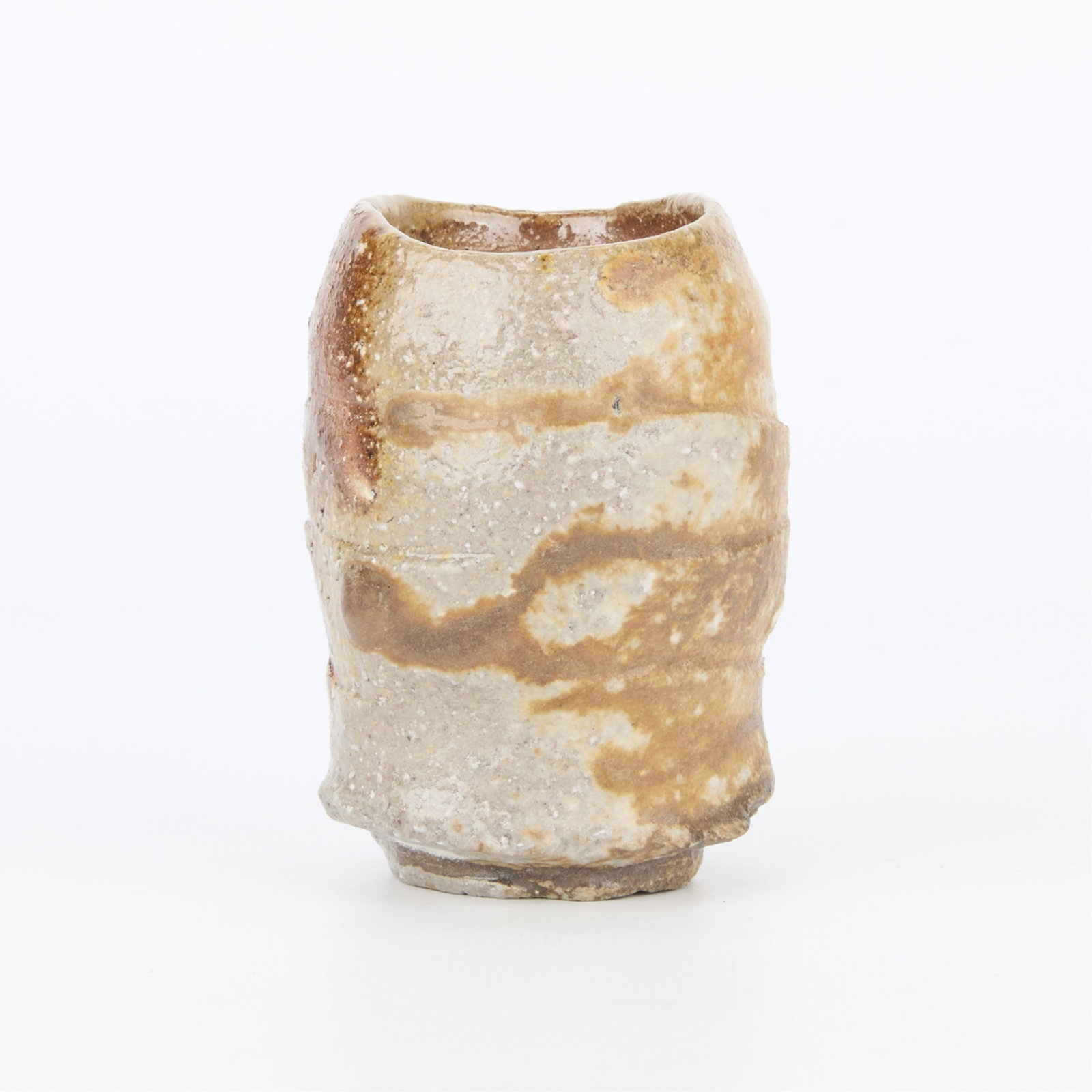 Kakurezaki Ryuichi Studio Ceramic Guinomi Sake Cup: Kakurezaki Ryuichi (Japanese, b. 1950). Small studio ceramic sake cup or guinomi, ca. 20th century. Stoneware of a coarse clay; side fired with wood ash gradient along the exterior. With a lovely undu