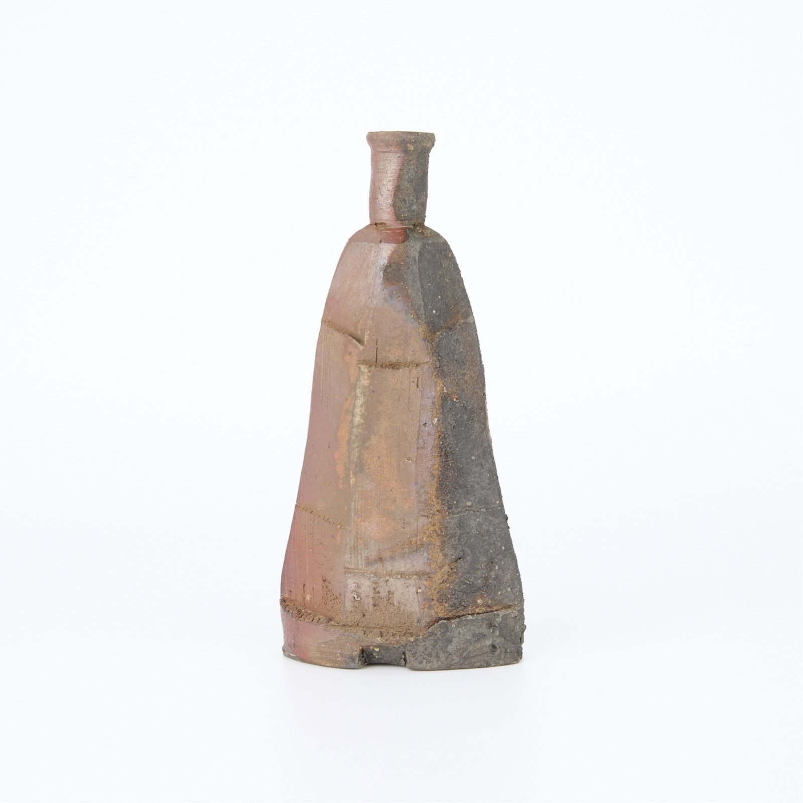 20th c. Japanese Studio Ceramic Sake Bottle: Contemporary Japanese studio ceramic sake bottle, 20th century. Wood-fired stoneware of a distinctive triangular form with angular facets, giving it a unique and asymmetrical silhouette. Likely reduct