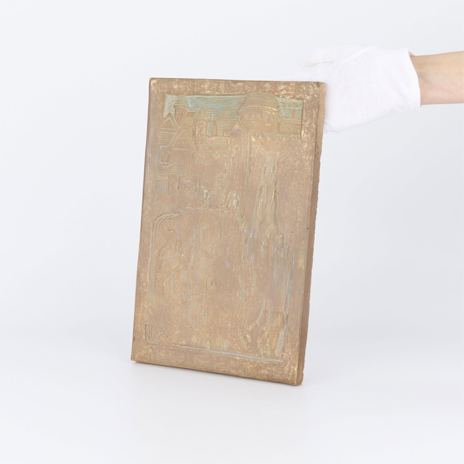 Tall Batchelder Ceramic Tile with Castle: Ernest A. Batchelder (American, 1875-1957). American Arts and Crafts ceramic pottery tile. Depicting a fantastic landscape with a castle. Impressed marks along the verso.Height: 13 1/2 in x width: 8 1