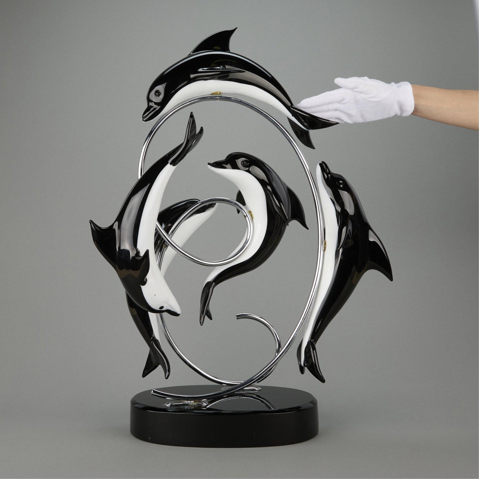 20th c. Seguso Vetri d'Art Glass Dolphin Sculpture: Possibly Seguso Vetri d'Art, Italy. Large sculpture depicting black and white Murano glass dolphins affixed to a looping curvilinear chrome frame, mid- to late 20th century. Etched illegibly, possibly
