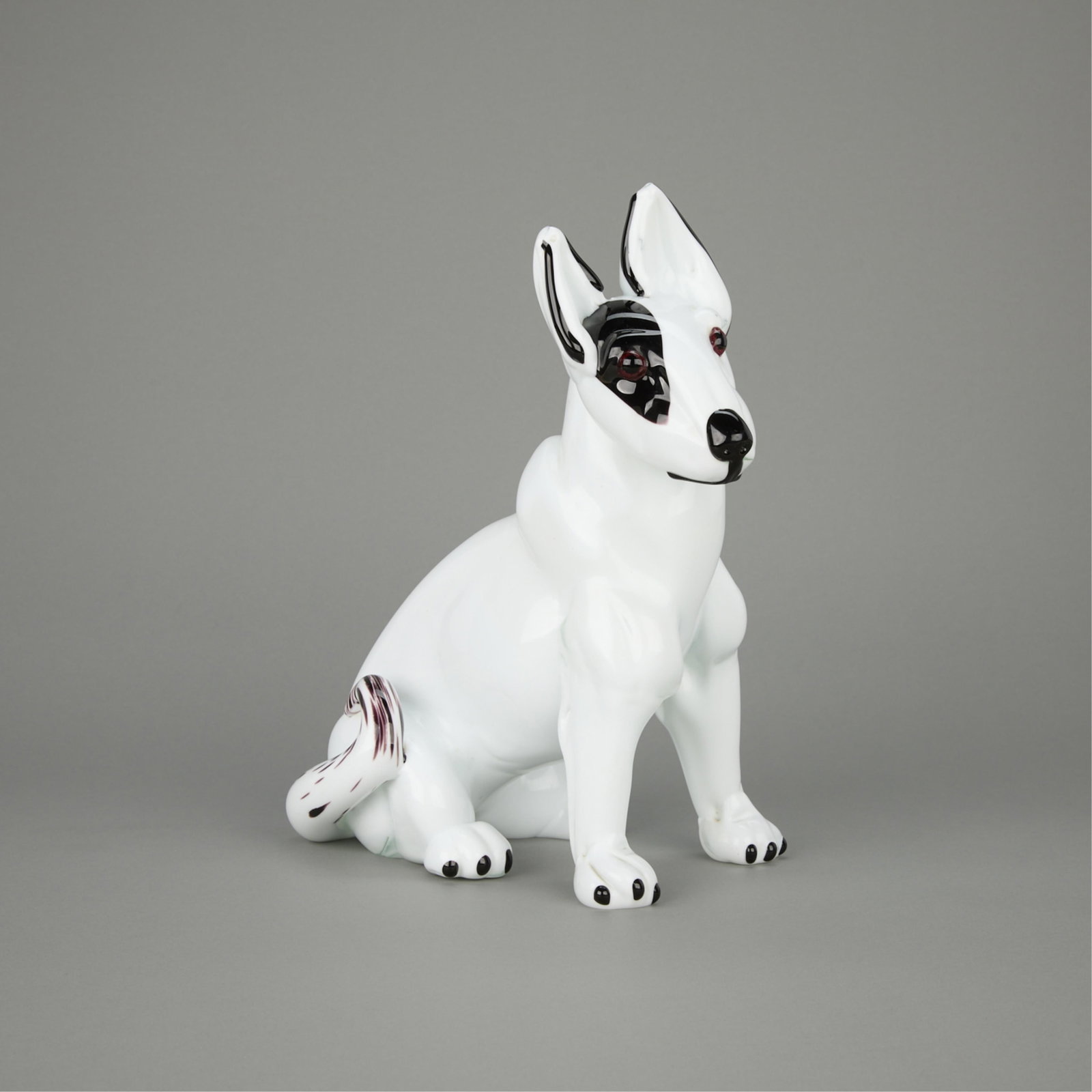 20th c. Attributed Cenedese Murano Milk Glass Dog: Attributed to Cenedese Murano, Italy. Murano glass sculpture depicting a seated bull terrier dog executed in "bianco e nero" or opaque black and white milk glass, mid-20th century. Height: 1