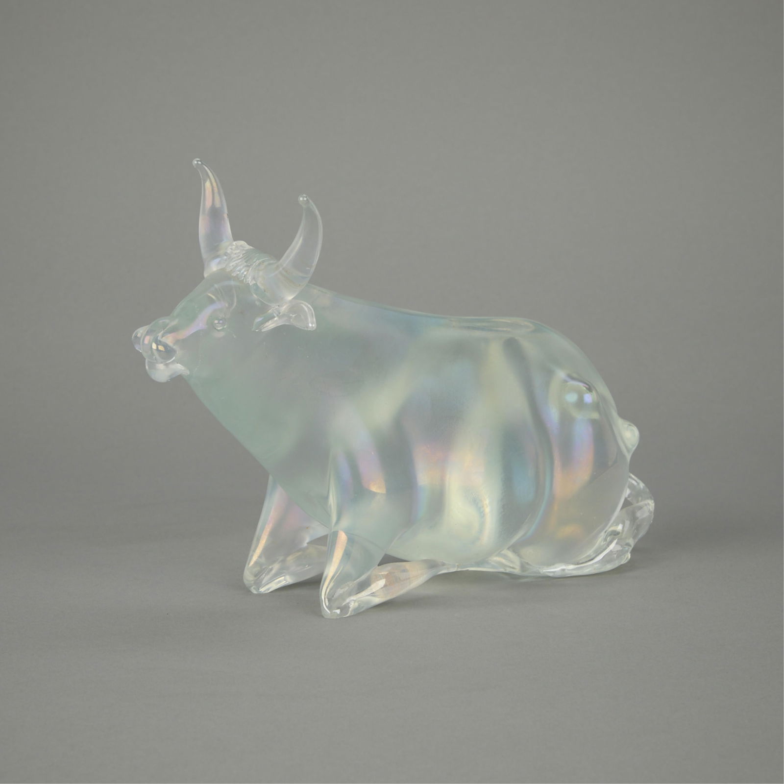 Attributed to Seguso Murano Glass Bull ca. 1949: Attributed to Archimede Seguso (Italian, 1909-1990). Iridescent Murano crystal glass figure depicting a "toro" or bull in repose, ca. 1949-59.Height: 6 1/2 in x width: 9 1/2 in x depth: 3 in
