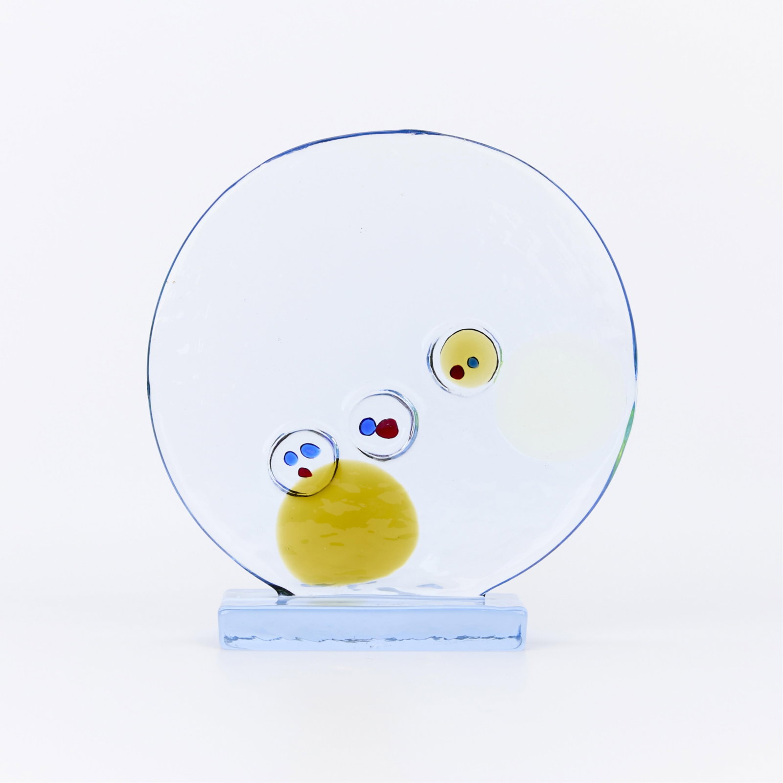 Livio Seguso Abstract Murano Glass Disk Sculpture: Livio Seguso (Italian, b. 1930). Abstract Murano glass sculpture in the form of a large clear disk featuring three suspended orbs of applied glass decoration in red, blue, and amber, reminiscent of fi