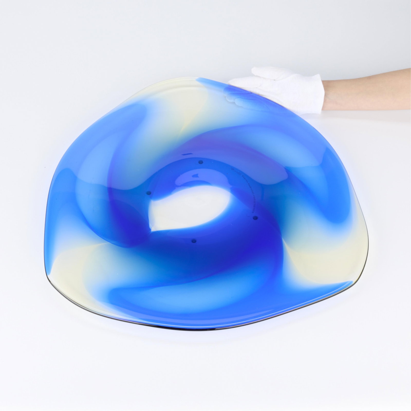 Hydman-Vallien for Kosta Boda Large Glass Charger: Ulrica Hydman-Vallien (Swedish, 1938-2018) for Kosta Boda. Large freeform charger in blue and translucent glass, ca. 1970s-80s. Of a highly unique shape, resembling a triangular vessel with rounded ed