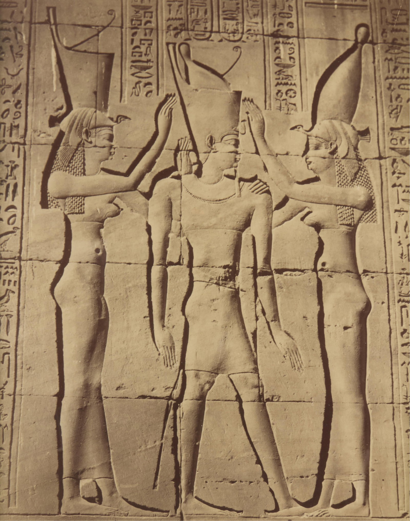 19th c. Albumen Print - Egyptian Coronation Relief: Late 19th century albumen photograph print depicting hieroglyphics of a coronation. The relief depicts Pharaoh Ptolemy VIII between two goddesses in the Temple of Horus, Edfu, Egypt. The reliefs were 