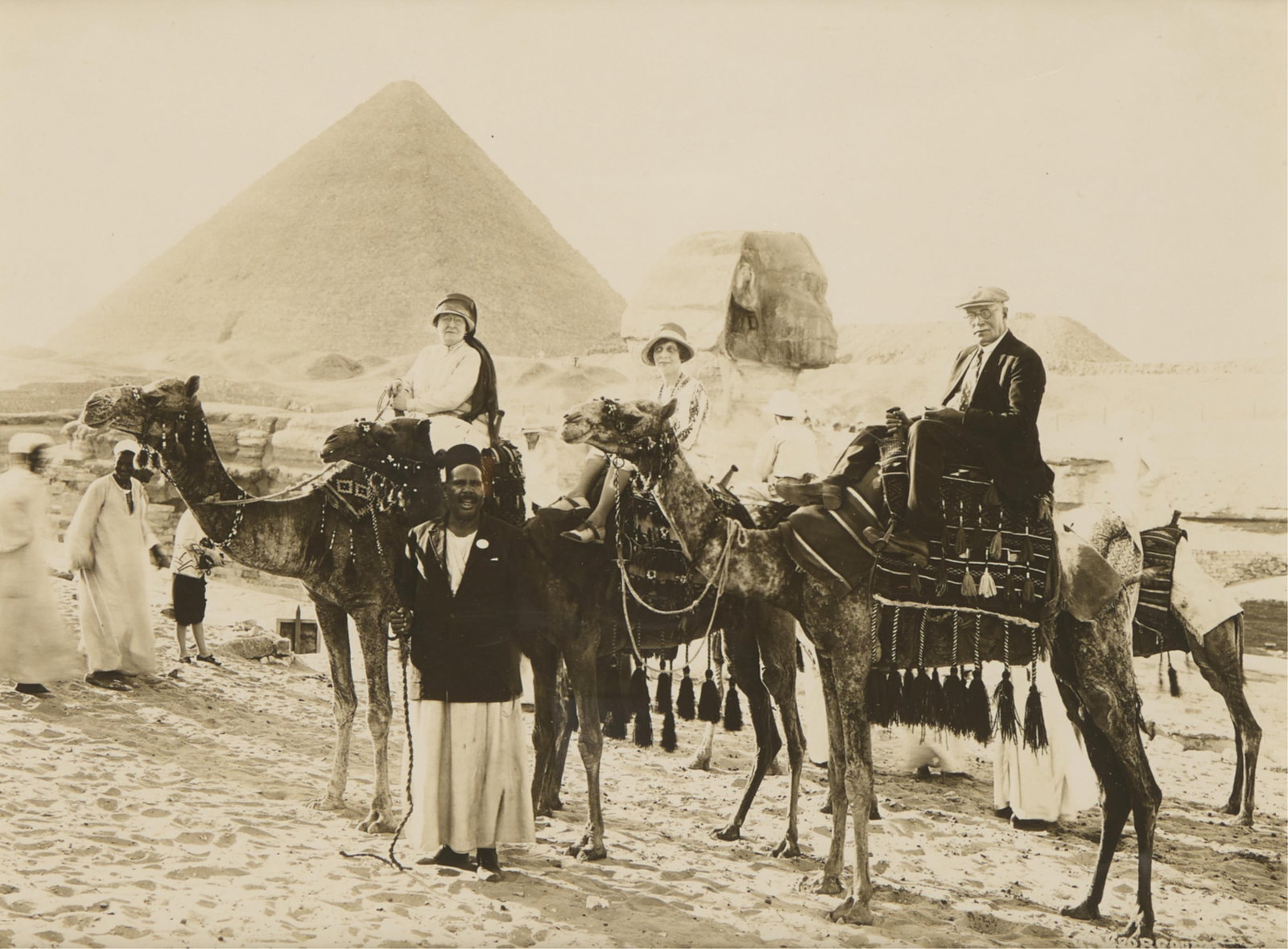19th c. Albumen of Giza Sphinx & Pyramid: Late 19th century albumen photograph print depicting three figures atop camels posing in front of the Great Sphinx and the Great Pyramid of Giza. Lot Essay: These 1855-1900s albumen photographs of &qu