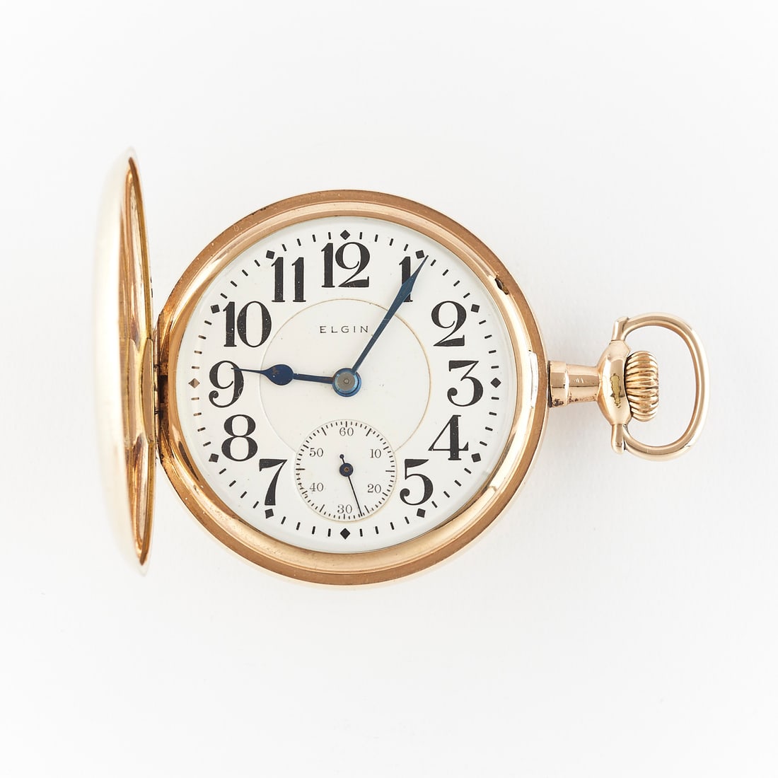Elgin BW Raymond Gold Filled Hunter Watch: Elgin National Watch Co., United States. One BW Raymond pocket watch. Gold filled case with foliate border and HNM monogram. White dial marked Elgin with Arabic numeral hour markers, sub-seconds dial 