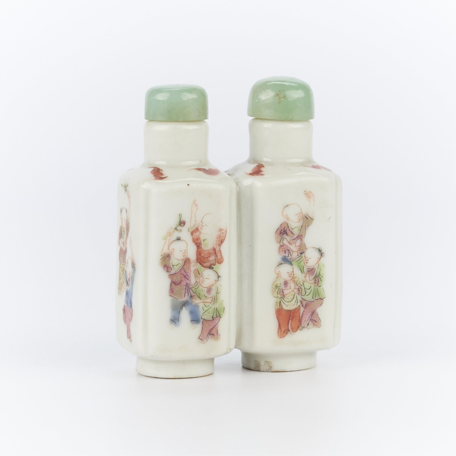 Chinese Double-Barrel Porcelain Snuff Bottle: Chinese double-barrel porcelain snuff bottle with underglaze depicting children in various pursuits, ca. 19th century. Stamped along the underside with four-charcter Yongzheng Emperor mark. Height: 2 