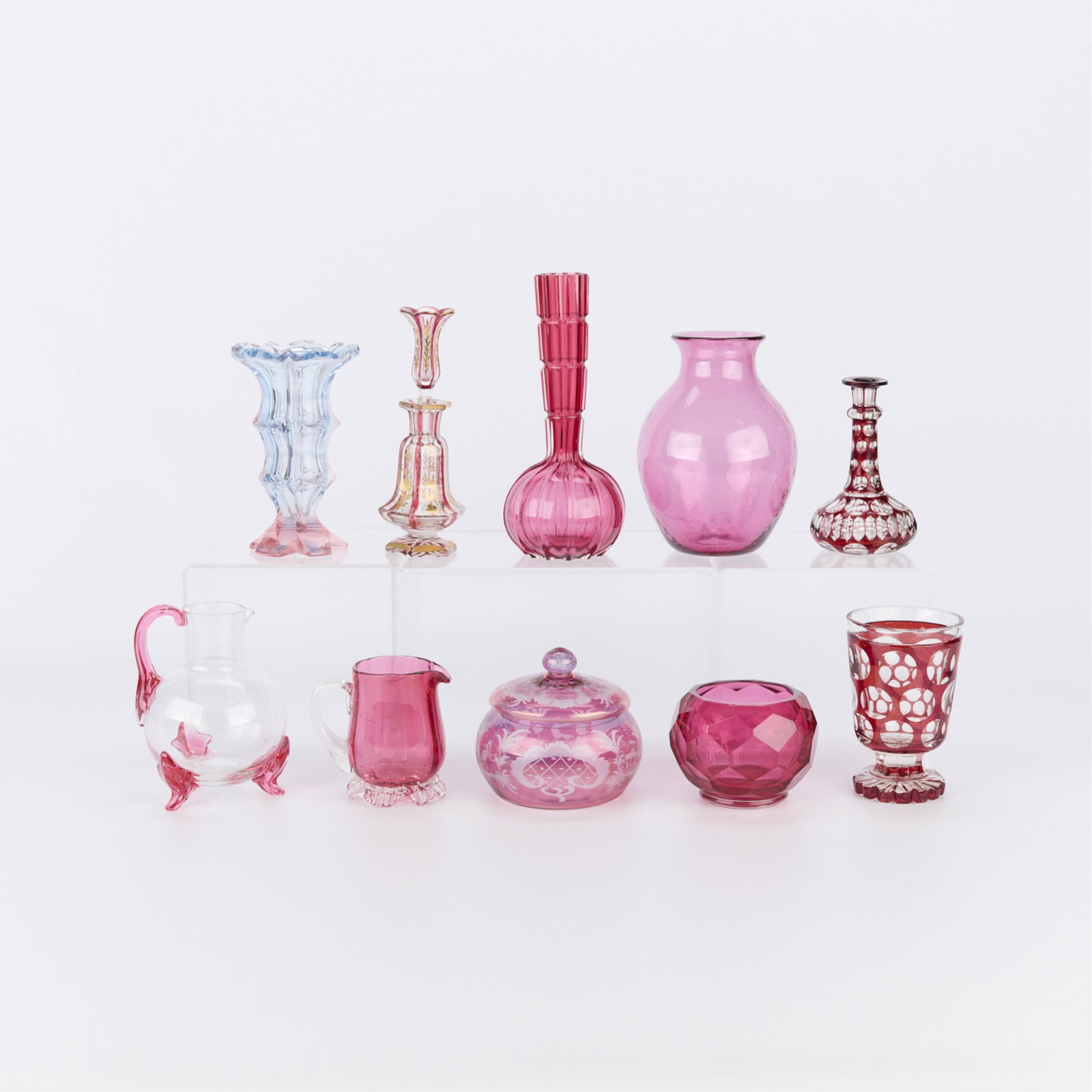 Grp 10 Vintage Cut Ruby Cranberry Glass Vessels: Group of ten assorted vintage cut ruby or cranberry glass stemware vessels including decanters, vases, and bowls. Height ranges from 2 in to 8 1/2 in; diameter ranges from 1 1/2 in to 5 in.