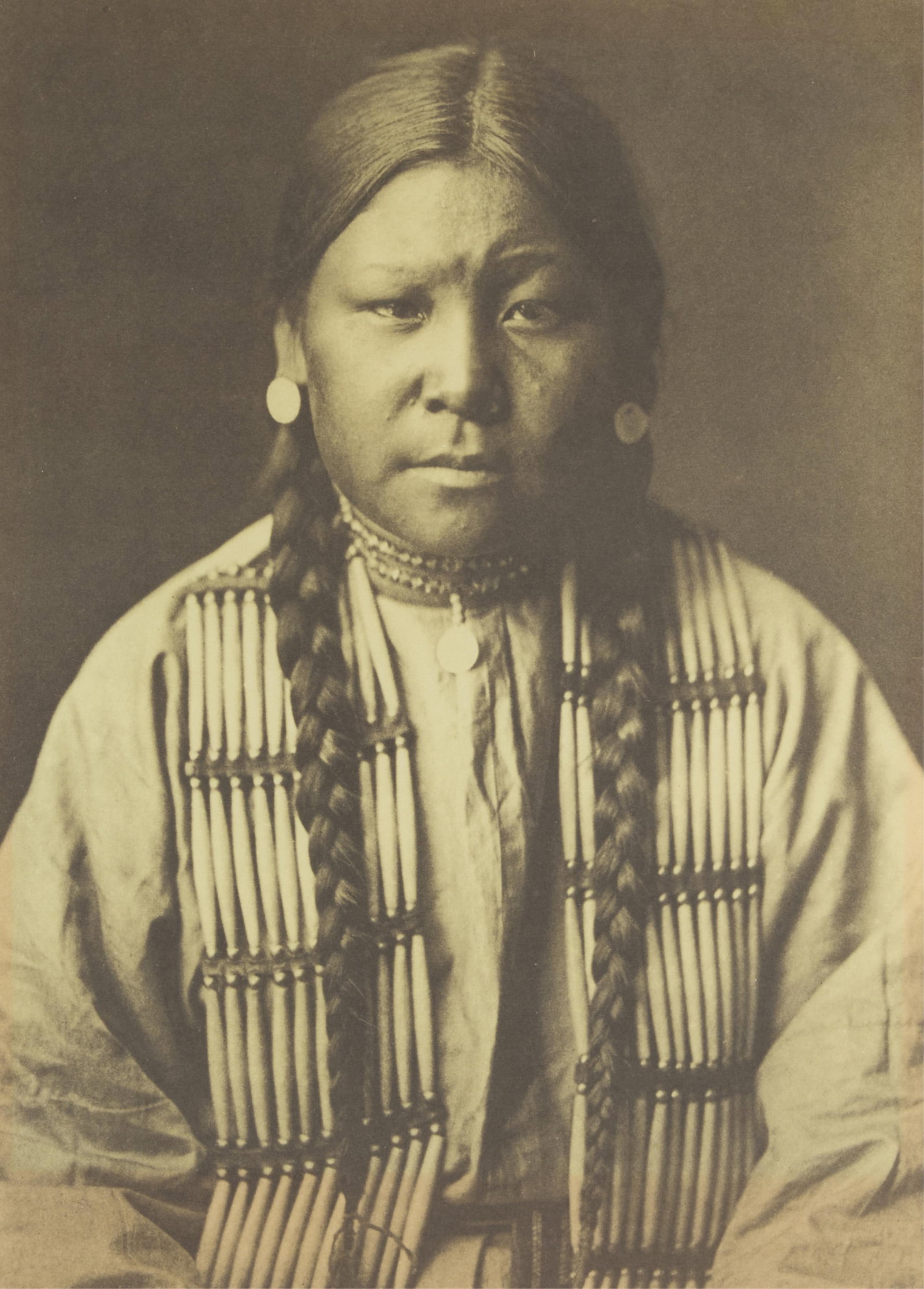 Edward Curtis "Cheyenne Girl" Photogravure: Edward Curtis (American, 1868-1952). Photogravure titled "Cheyenne Girl" depicting a portrait of a young seated girl. Titled in print along the lower left. Sight; height: 17 in x width: 11 1