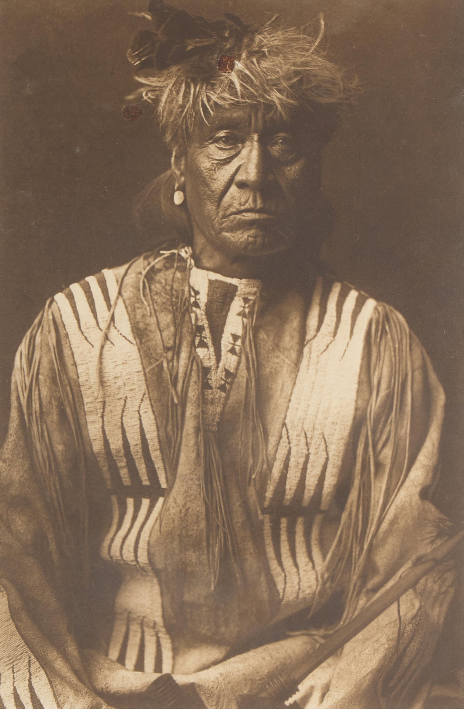 Edward Curtis "Red Whip" Photogravure 1908: Edward Curtis (American, 1868-1952). Photogravure titled "Red Whip - Atsina" depicting a portrait of a seated man, ca. 1908. Title along the lower right, "From Copyright Photograph 1908
