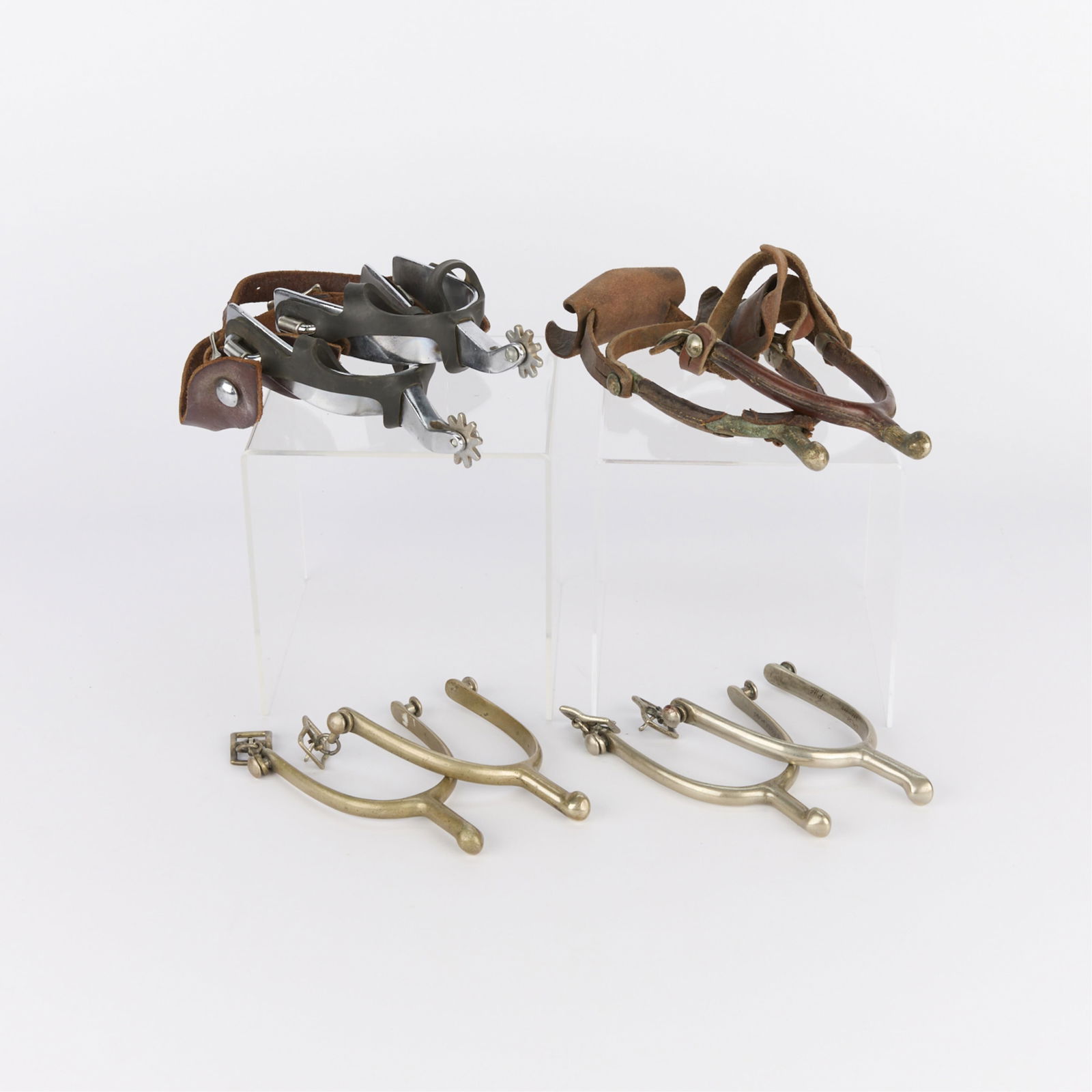 4 Pairs Antique Spurs Incl. Crockett & A. Buermann: Group of four pairs (eight total) antique spurs including A. Buermann and Crockett spurs. Two pairs with leather straps. One pair without leather straps stamped along the interior "U.S." and