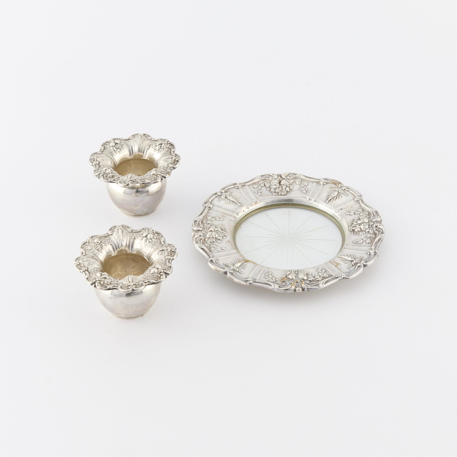 3 Pcs Reed & Barton "Francis I" Sterling: Group of three pieces of Reed & Barton Francis I pattern vases and plate. Including one small silver plate with glass center with starburst in the glass. Marked Reed & Barton Sterling Francis I. Two b