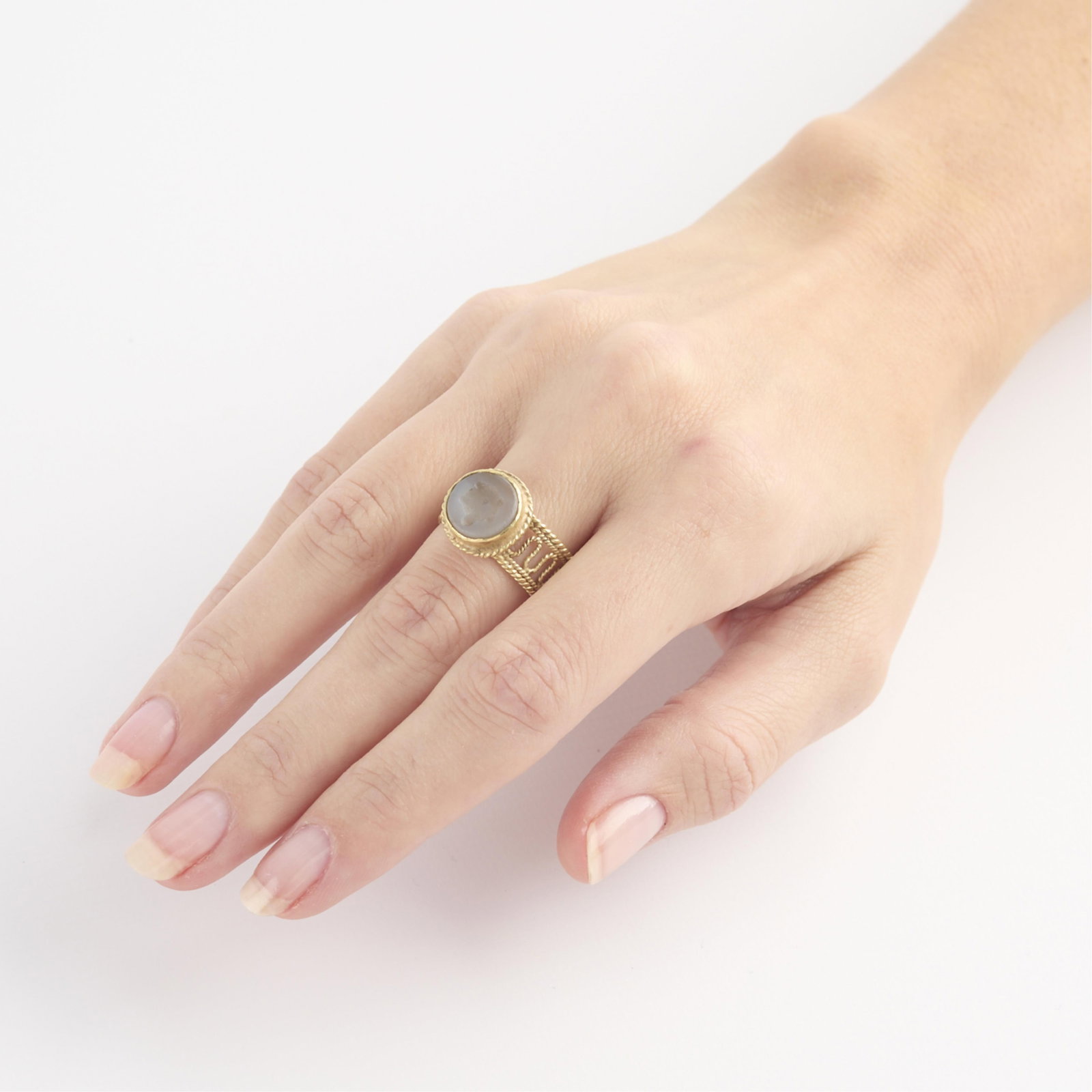 14k Yellow Gold Classical Intaglio Ring: 14k yellow gold ring with twisted rope band set with circular agate hardstone classical intaglio of a turtle. Gold content unmarked, tested 14k. Ring size: 7 US. Gross weight: 4.8 g.