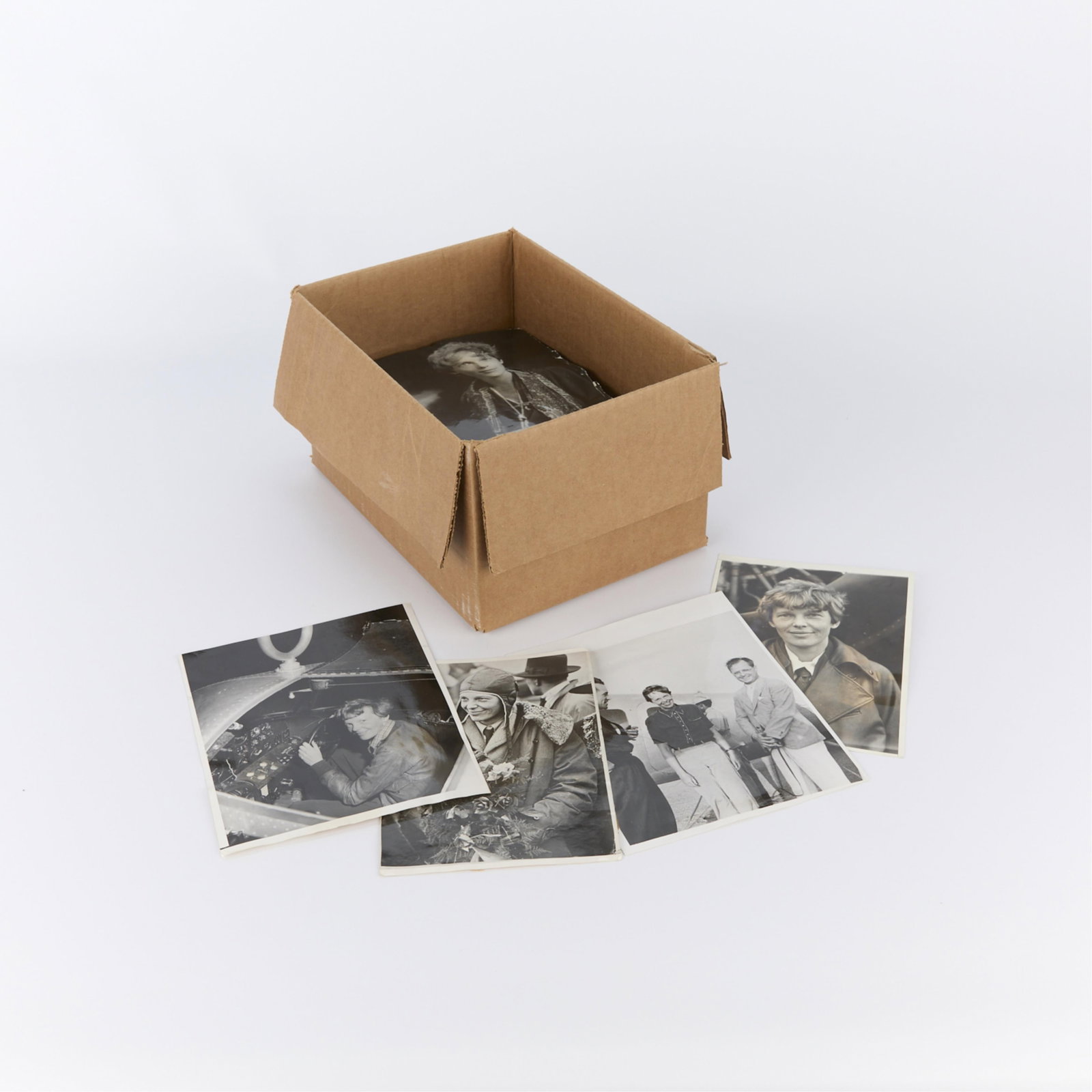 Box Amelia Earhart Photographs from Star Tribune: Large group of silver gelatin print press photographs depicting famed pilot Amelia Earhart and her family from the archives of the Star Tribune. Provenance: From the archives of the Star Tribune, esta