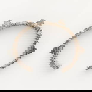 William Spratling Cuff Bracelet: William Spratling silver cuff bracelet with protruding trapezoidal details and incised linear details. Marked Spratling silver and Spratling Made in Mexico along the interior.Diameter: 2 1/4 in. Gross