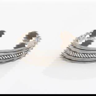William Spratling Sterling Silver Cuff: William Spratling sterling cuff bracelet with rope detail and lobed ends. Marked sterling silver and Spratling Made in Mexico along the interior.Diameter: 2 1/4 in. Gross weight: 42.7 g.
