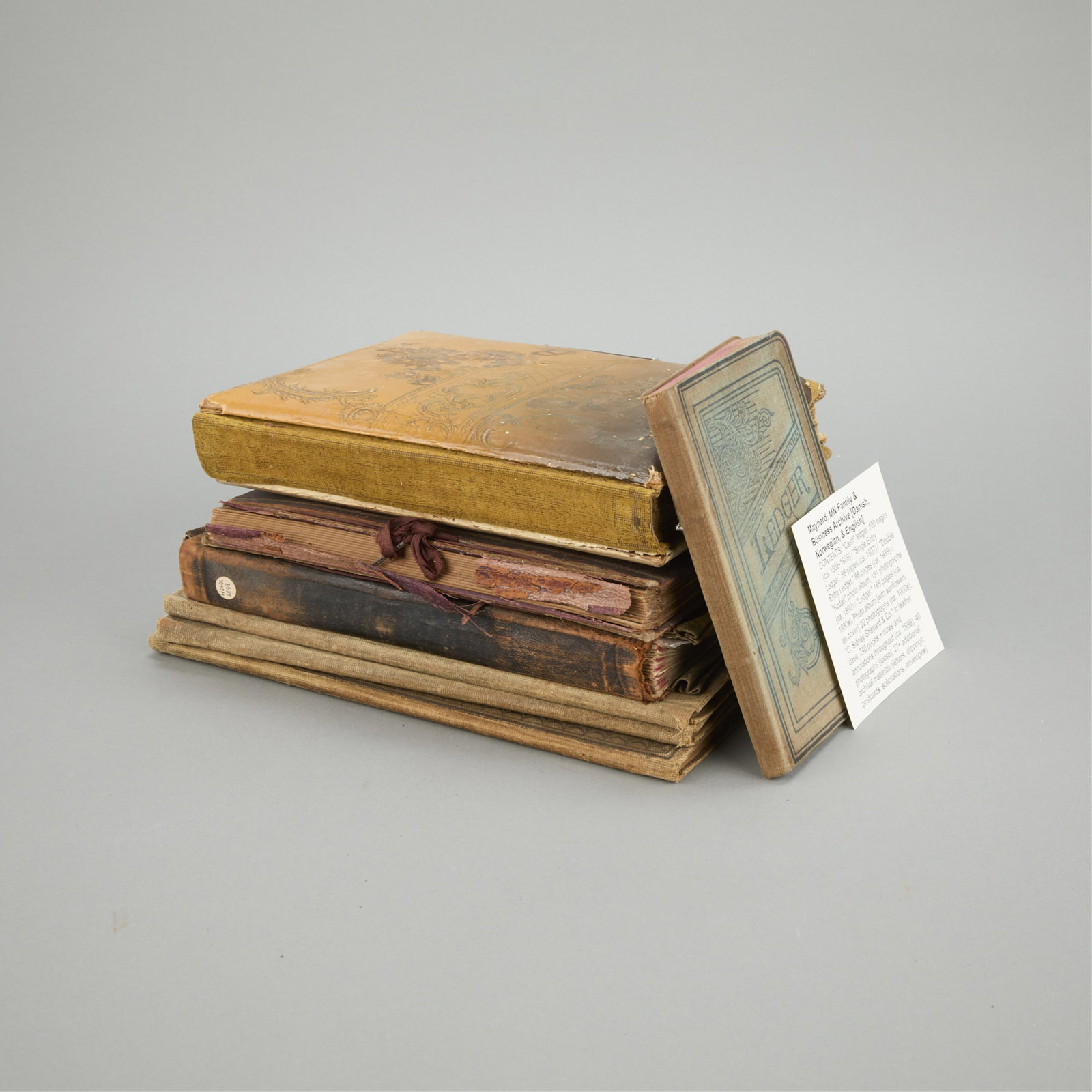 Group of Maynard Minnesota Archives & Ephemera: Group of archival ephemera relating to families and businesses in Maynard, Minnesota. Includes photographs, written documents, journals, ledgers, and additional written documents in English, Danish, a