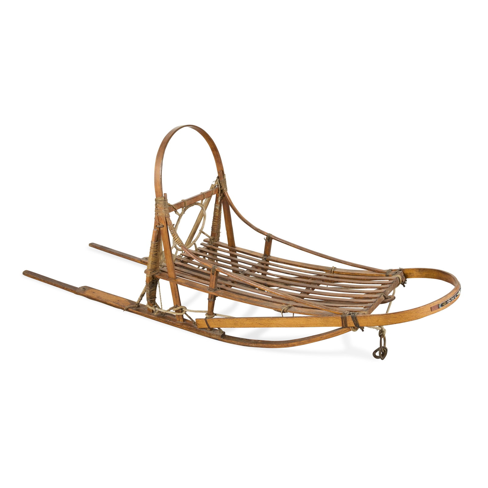 20th c. Wooden Bentwood Dog Sled w/ Beadwork: Early to mid-20th century wooden bentwood racing style dog sled. With beaded thunderbird design along the brush bow. Height: 36 in x width: 90 in x depth: 21 in.