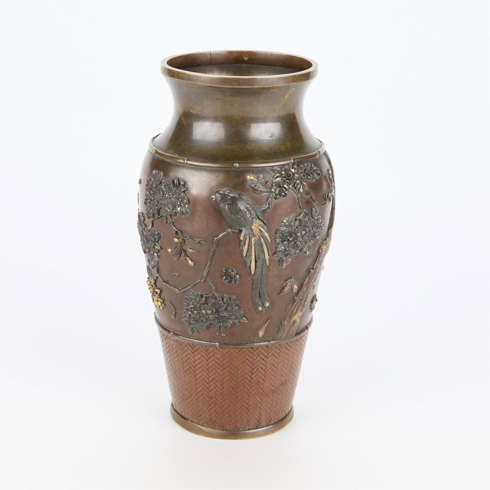 Japanese Meiji Mixed Metal Baluster Vase: Japanese mixed metal baluster form vase depicting a bird of paradise among cherry blossom branches and sparrows in flight along the reverse, Meiji period. With basket weave sheathing along the lower t