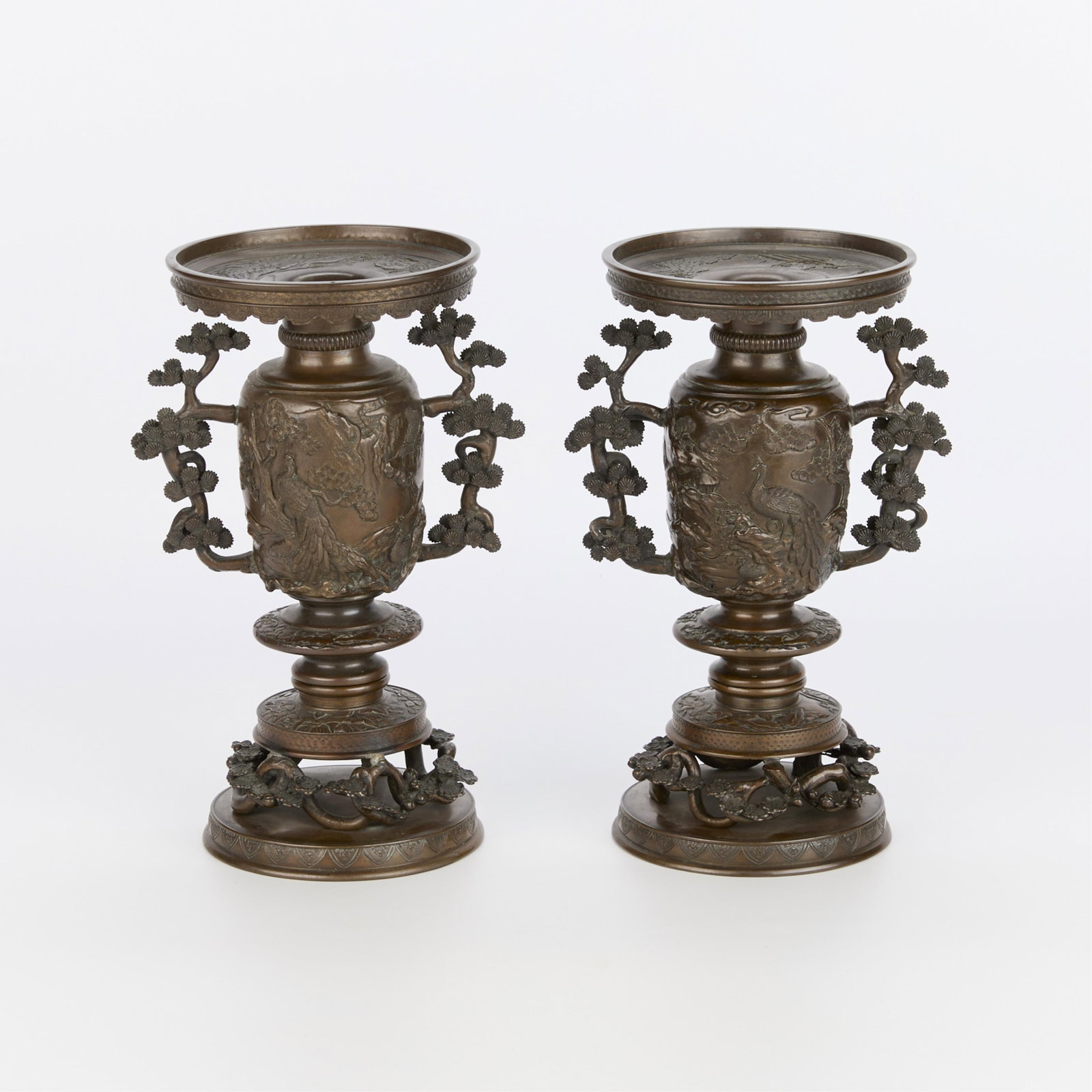 Pr Japanese Bronze Usubata Vases: Pair of Japanese bronze usubata vases, likely Meiji era. Comprised of a circular flanged foot upon which rests a curving branch with blossoms. The body of the vase rests upon these branches and are de
